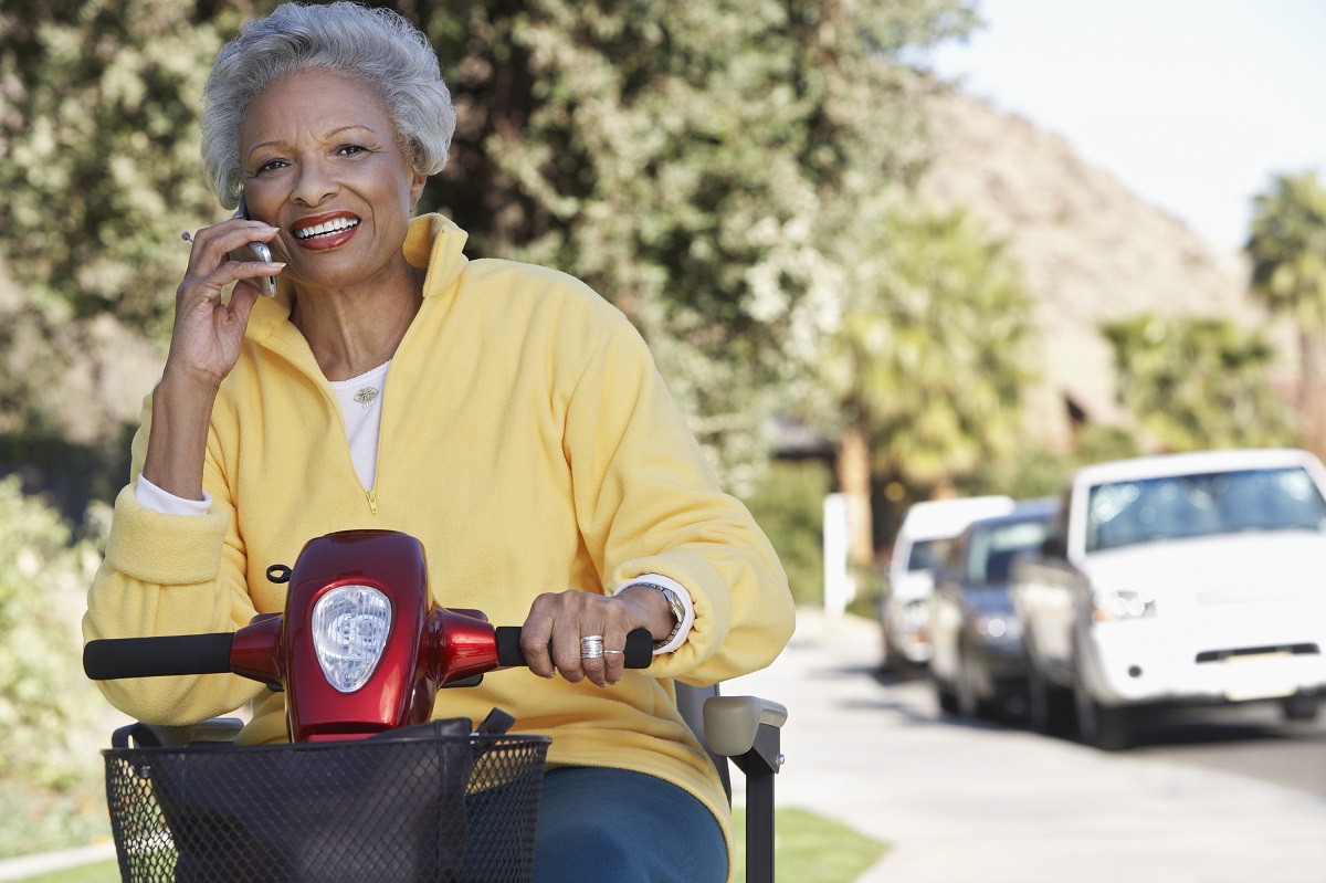 Elderly woman in a mobility scooter